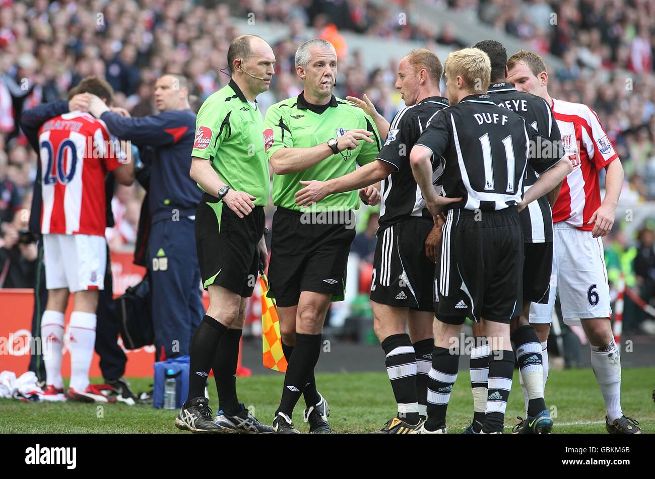 tempers flare as Newcastle United's Sebastien Bassong (not pictured) and James Beattie (left) clash, leaving the latter receive treatment for a head injury Stock Photo