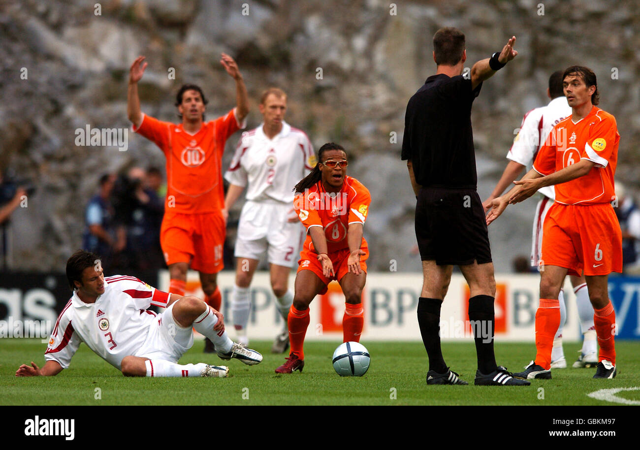 Soccer - UEFA European Championship 2004 - Group D - Holland v Latvia. Holland's Edgar Davids appeals to referee Kim Milton Nielsen after a foul on Latvia's Vitalijs Astafjevs Stock Photo