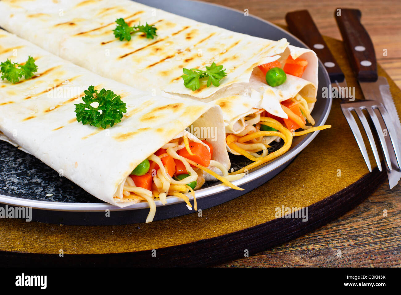 Pita Bread with Vegetables, Chinese Noodles and Arugula Stock Photo