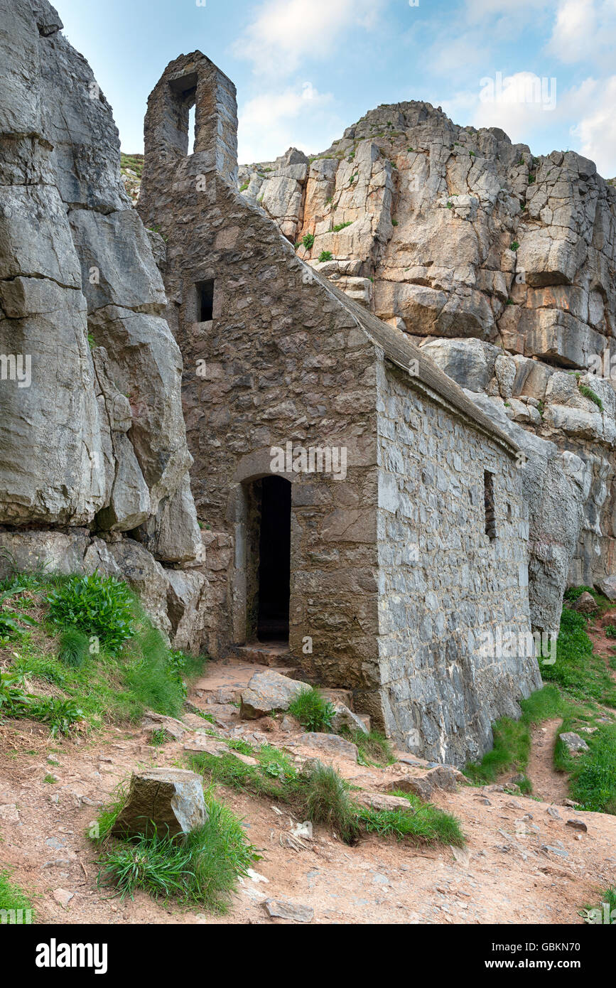 St Govan's chapel, an ancient hermit cell built into cliffs on the Pembrokeshire coast in Wales Stock Photo