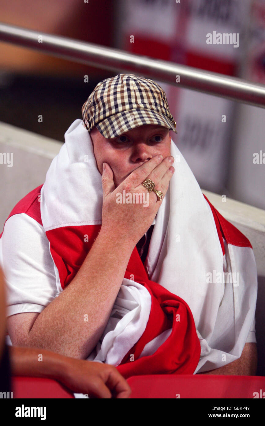 Soccer - UEFA European Championship 2004 - Quarter Final - Portugal v England. A dejected England fan cannot believe his team have been knocked out on penalties Stock Photo
