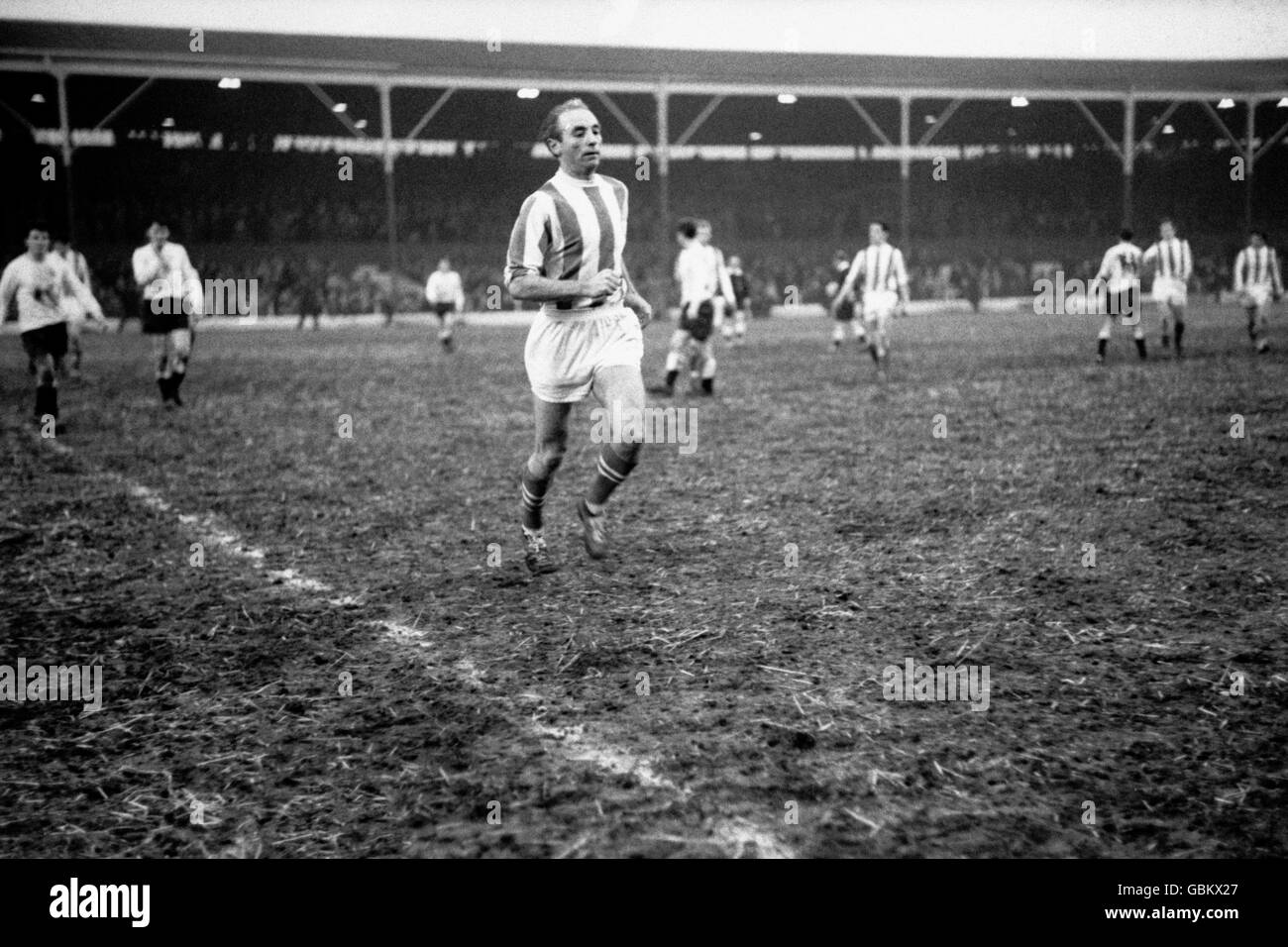 Stoke City's Stanley Matthews, aged 50 years and 5 days, sprints off the pitch at the final whistle Stock Photo