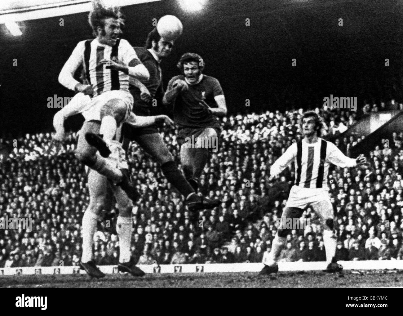 Liverpool's Larry Lloyd (second l) beats teammate John Toshack (second r) and Borussia Monchengladbach's Gunter Netzer (l) to a header, watched by Monchengladbach's Rainer Bonhof (r) Stock Photo