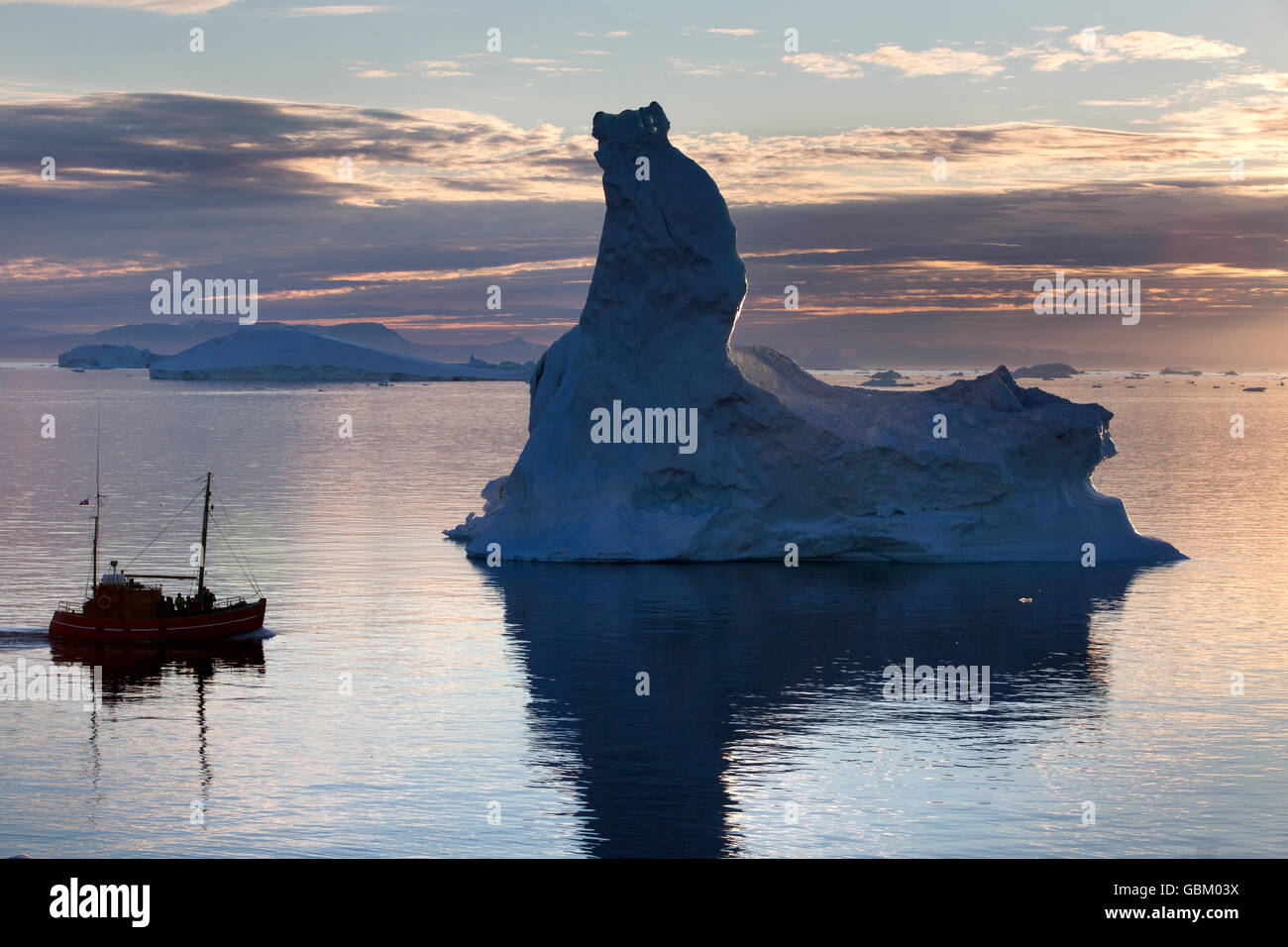 Iceberg, tour boat, midnight sun, Ilulissat, Greenland Stock Photo
