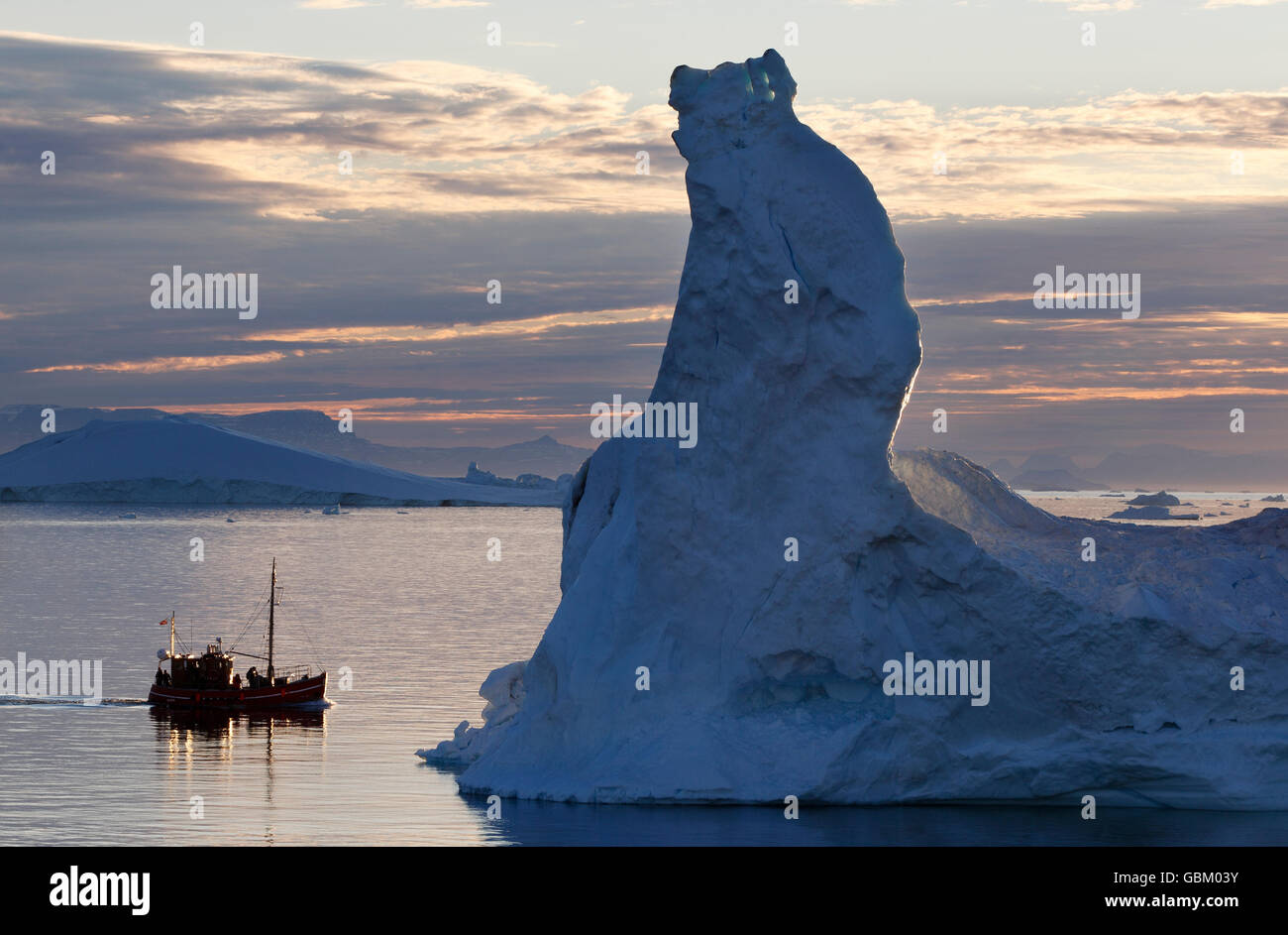 Iceberg, tour boat, midnight sun, Ilulissat, Greenland Stock Photo
