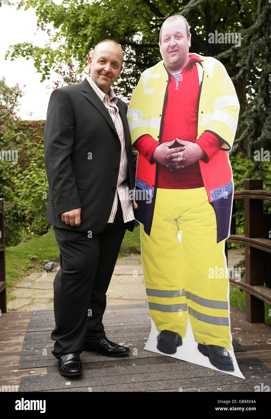 Forty year old John Devonshire (who now weighs 18st 13lbs, losing 16st 9lbs), from Llanrwst in Conwy, North Wales, poses with a cardboard cutout (taken when John weighed 30 stone) is crowned Slimming World's Greatest Loser 2009 from the 10 finalists at the awards, at Kensington Roof Gardens in west London, Thursday 30 April 2009. PRESS ASSOCIATION Photo credit should read: Yui Mok/PA Stock Photo