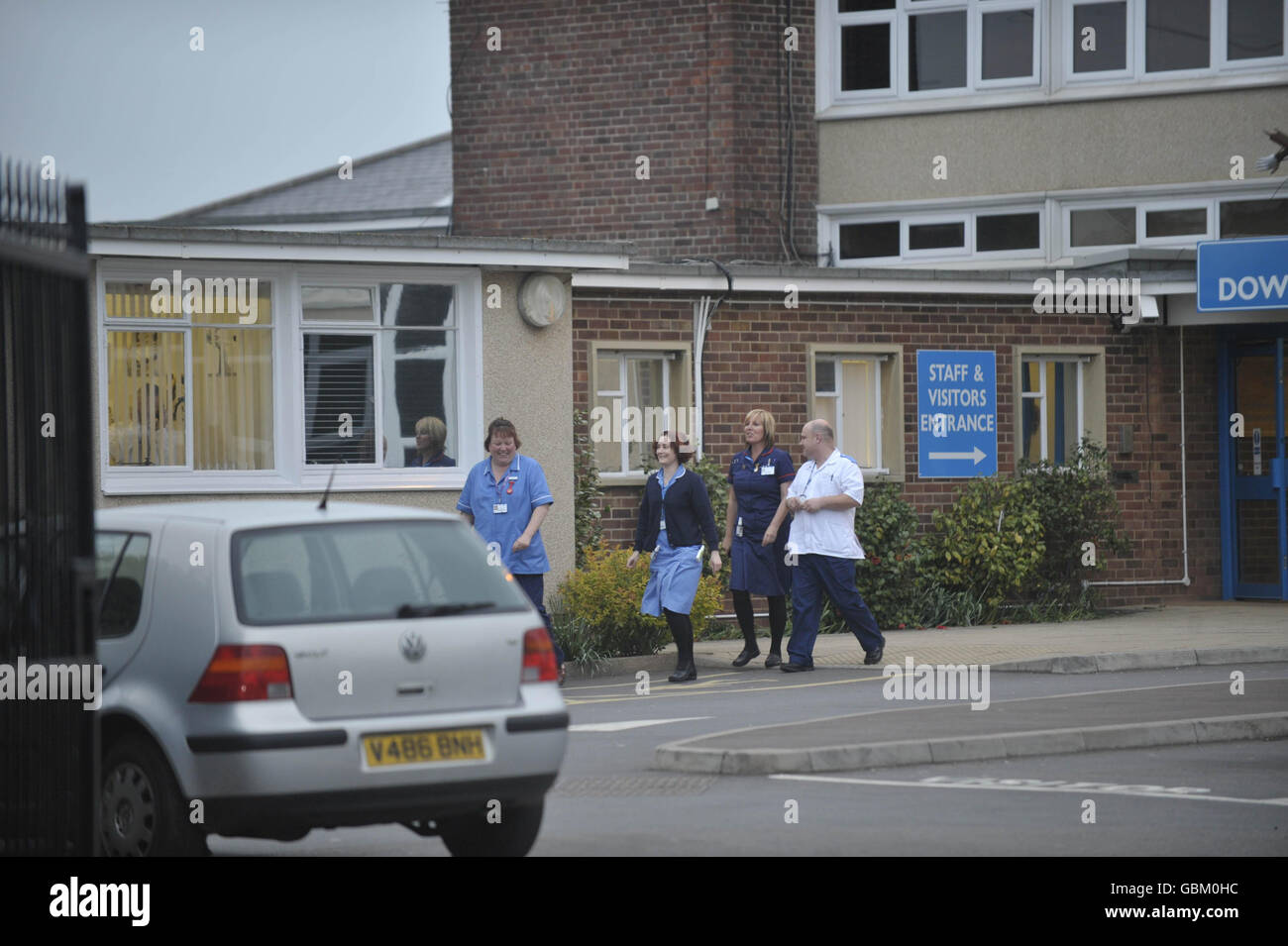 Health professionals outside Downend School technology college, South Gloucestershire, where a 12 year old girl has a confirmed case of swine flu. Stock Photo