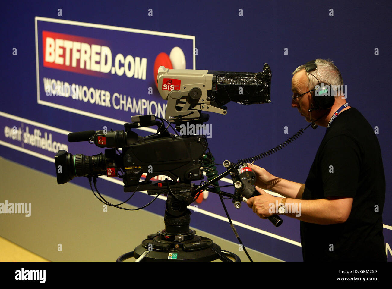 General view of an SIS Sony cameraman and camera filming the action during the Betfred World Snooker Championship at The Crucible Theatre, Sheffield Stock Photo
