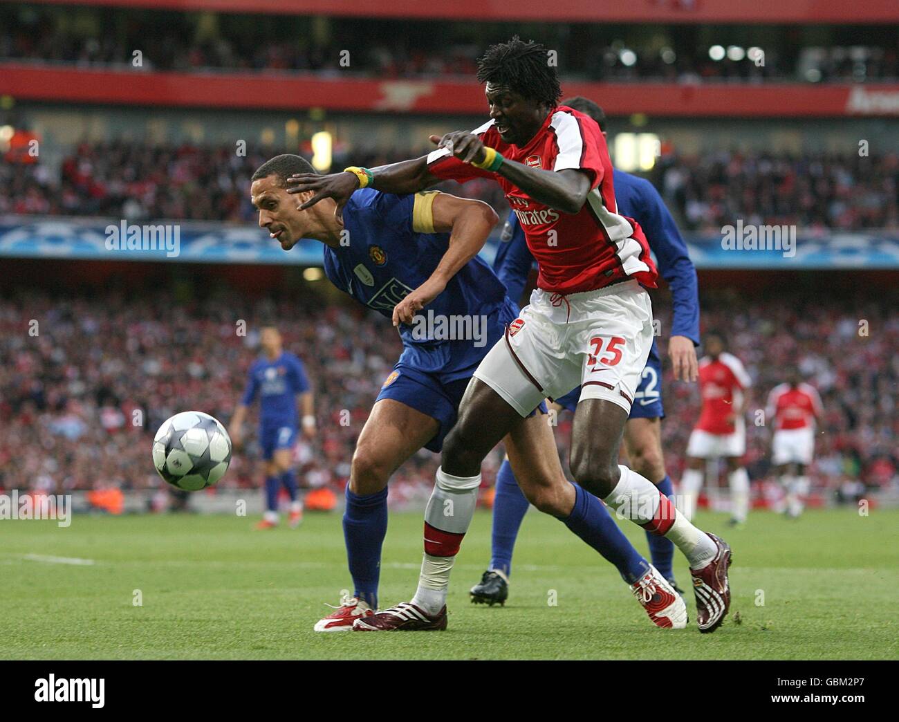 Soccer - UEFA Champions League - Semi Final - Second Leg - Arsenal v Manchester United - Emirates Stadium. Arsenal's Emmanuel Adebayor (right) and Manchester United's Rio Ferdinand battle for the ball Stock Photo