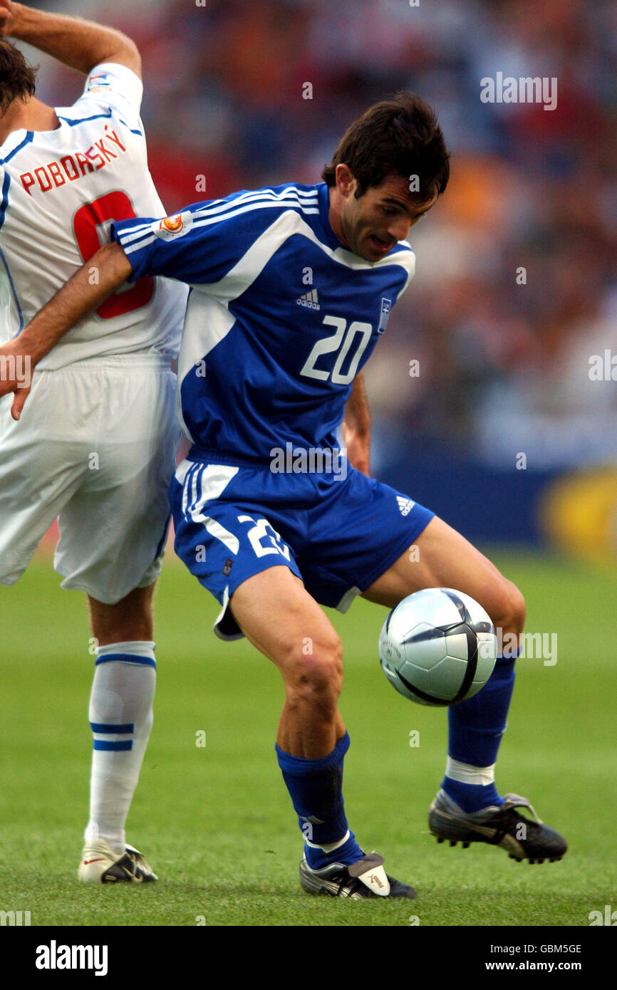 Soccer - UEFA European Championship 2004 - Semi Final - Greece v Czech Republic. Greece's Georgios Karagounis (r) and Czech Republic's Karel Poborsky battle for the ball Stock Photo