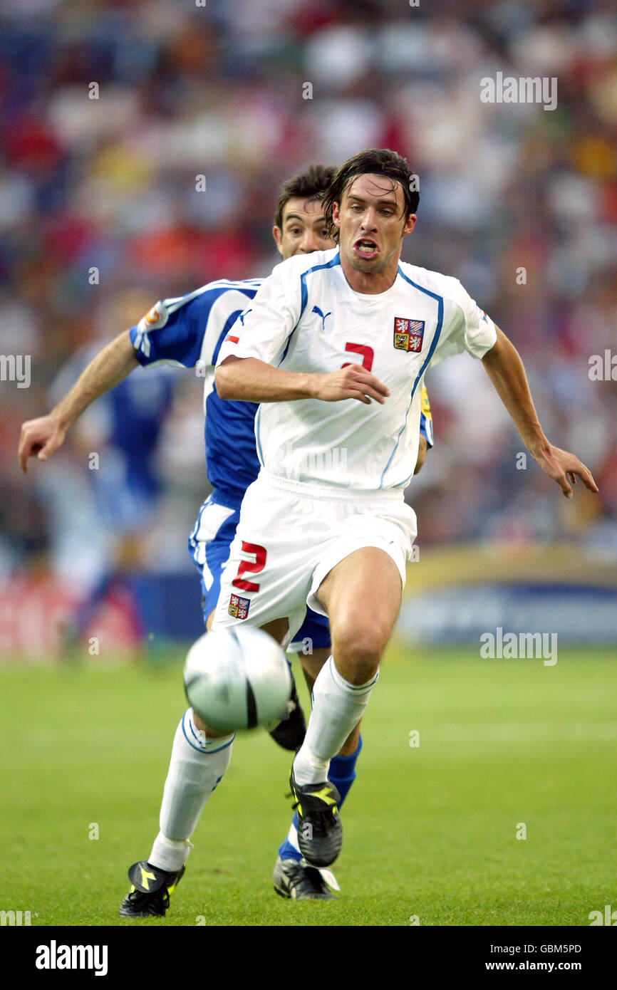 Soccer - UEFA European Championship 2004 - Semi Final - Greece v Czech Republic. Zdenek Grygera, Czech Republic (r) outruns Greece's Georgios Karagounis Stock Photo