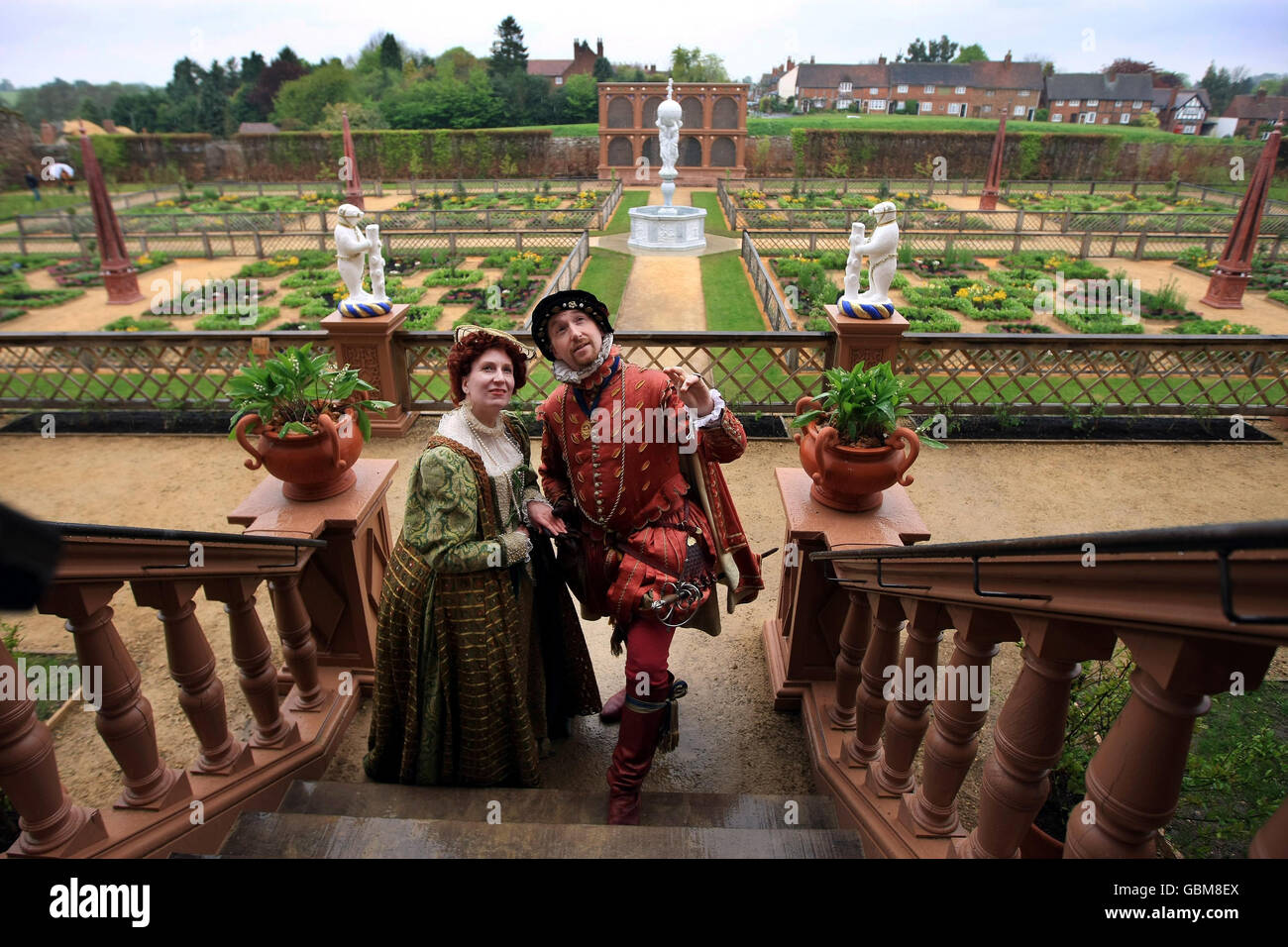 Charles Neville, dressed as Robert Dudley, 1st Earl of Leicester, and Hilary Janewood, dressed as Queen Elizabeth I, inspect the reconstruction of Kenilworth Castle gardens, which were originally commissioned by the Earl of Leicester to impress Queen Elizabeth I in 1575. Stock Photo