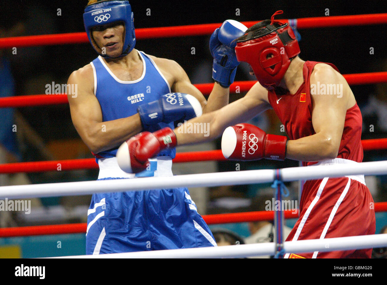 China's Yuping Lei (l) on his way to beating Camaroon's Pierre Celestin Yana (r) Stock Photo