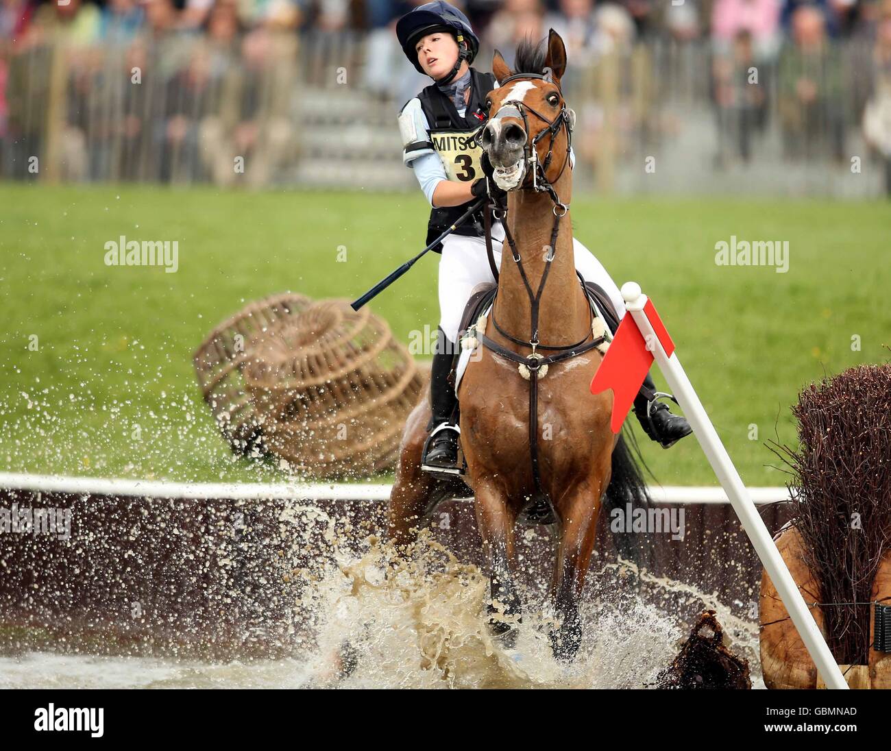 Emily Baldwin riding Drivetime fails to jump out of the water during the cross country competition at the Badminton Horse Trials 2009 Stock Photo