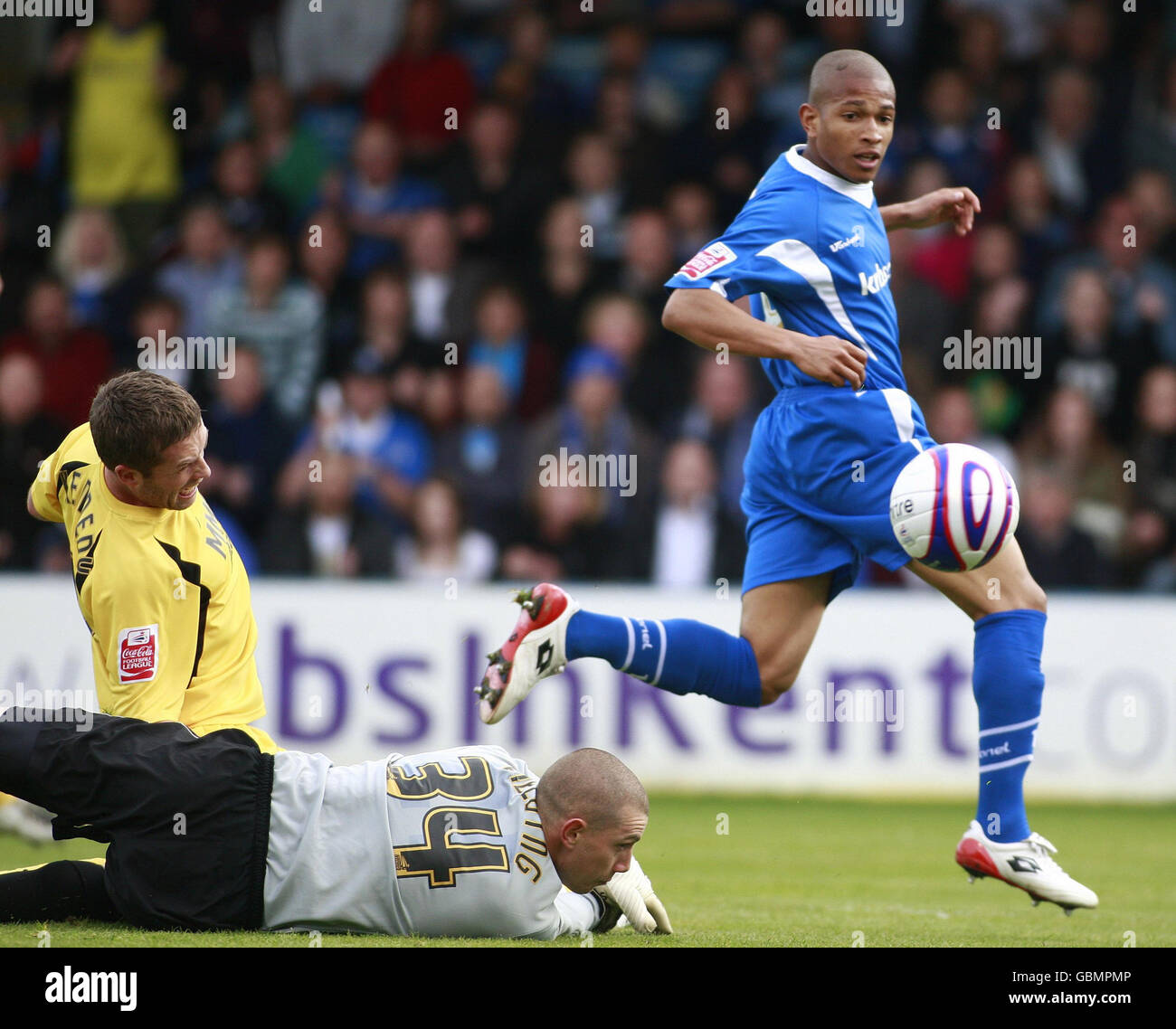Gillingham's Simeon Jackson scores during the CocaCola Football League
