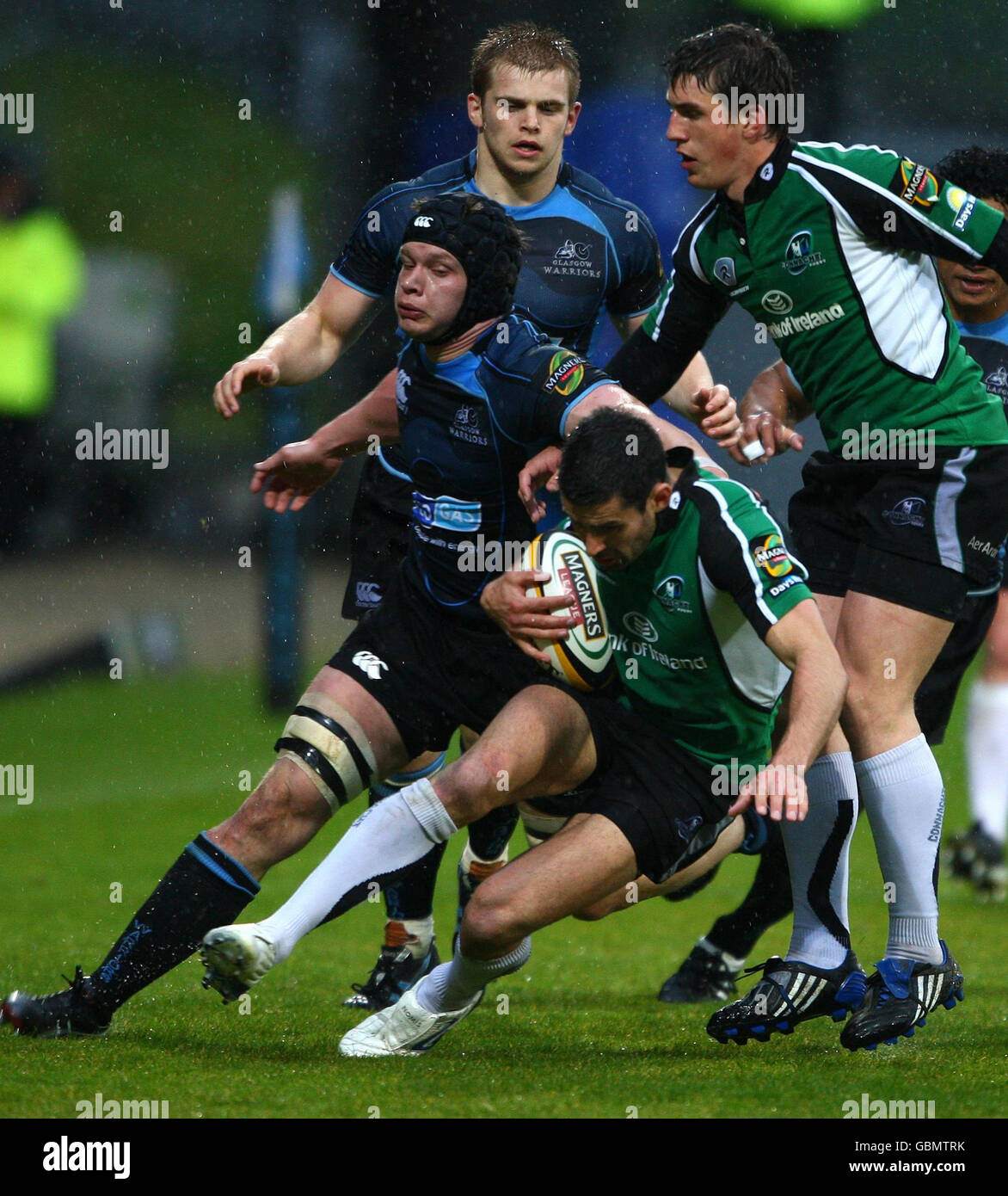 Glasgow Warriors' Callum Forrester attempts to bring down Connacht's Frank Murphy during the Magners League match at Firhill Stadium, Glasgow, Scotland. Stock Photo