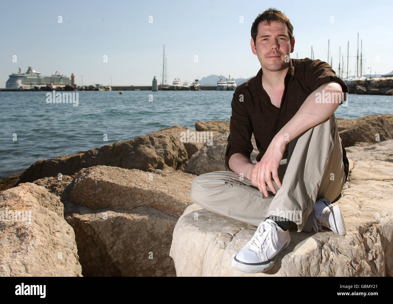 Film maker Marc Price, who has brought his zombie film 'Colin', made for a budge of 45, to the 2009 Cannes Film Festival, on the beach at Cannes, France. Stock Photo