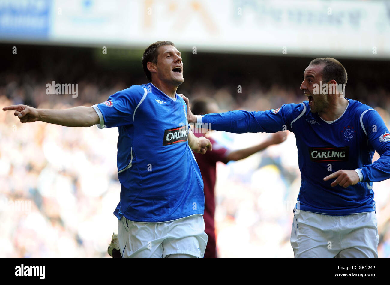 Glasgow rangers players celebrate goal hires stock photography and
