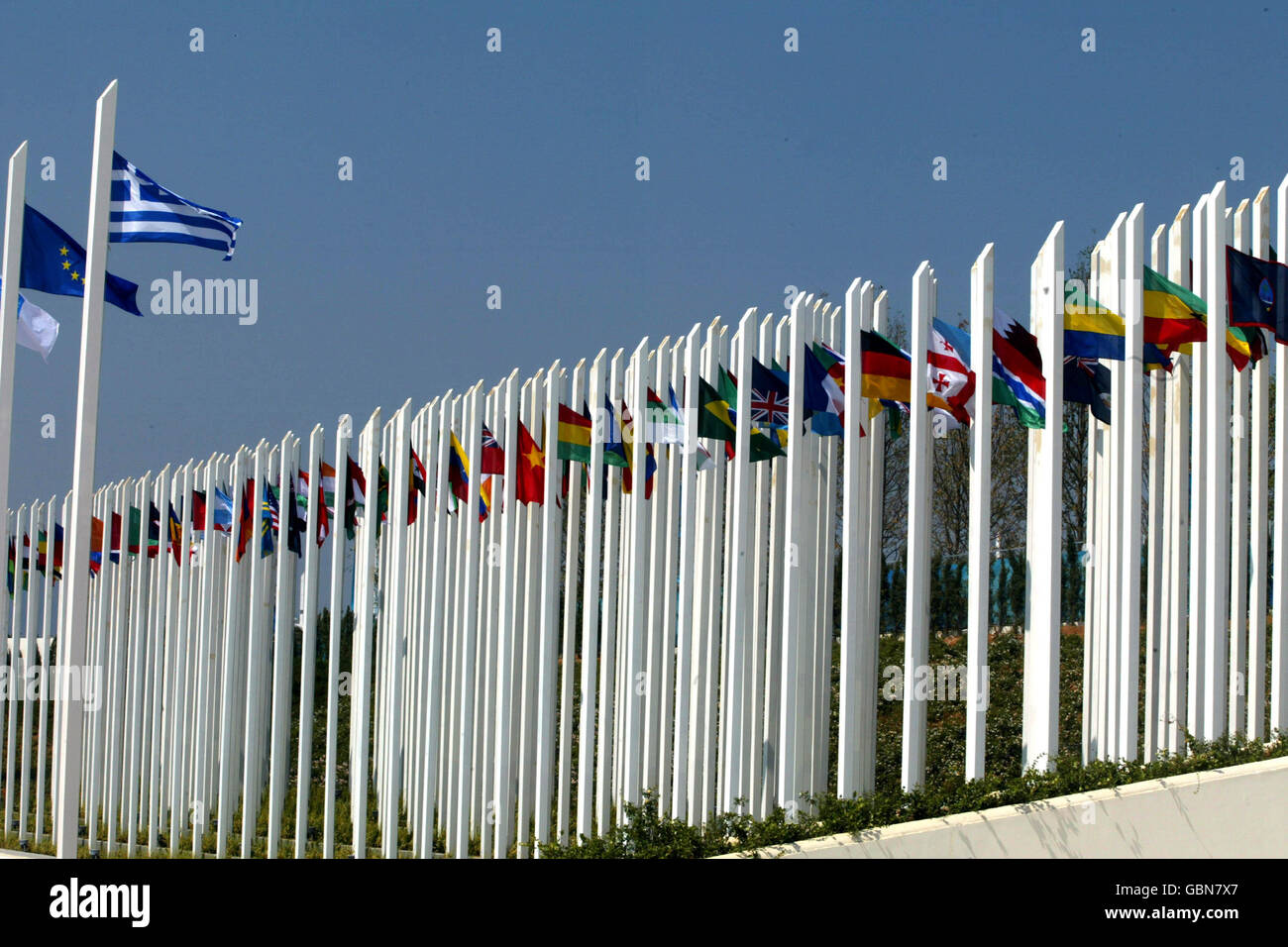 The Greek flag flies above the flags from the competing countries, at ...