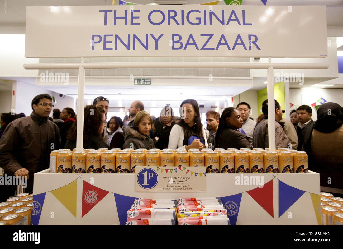 Customers queue for an exclusive range of M&S (Marks & Spencer) products priced at just one penny, to mark the store's 125th Birthday celebrations with the opening of the Original Penny Bazaar at the company's flagship store in Marble Arch, central London. Stock Photo