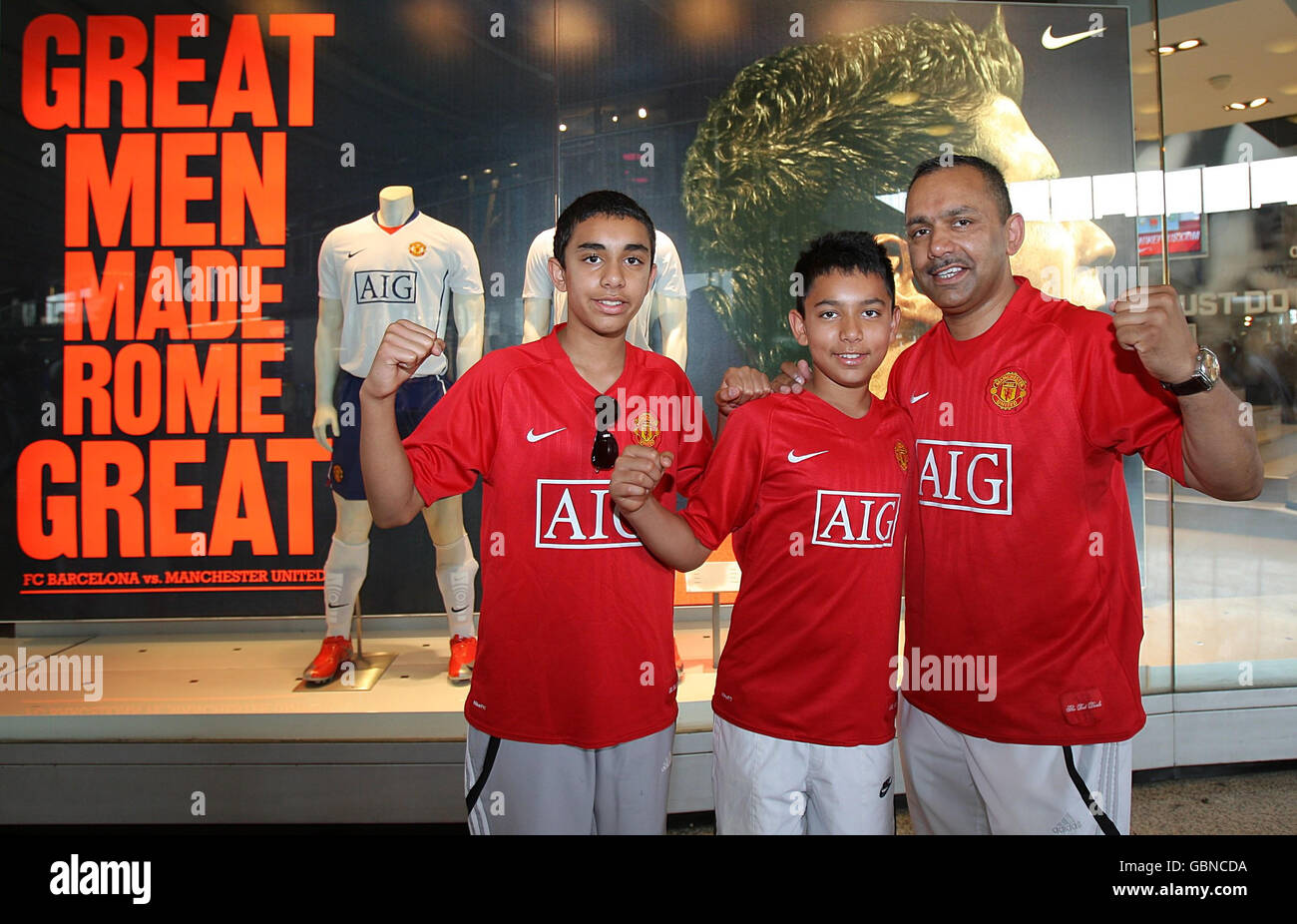 Three Manchester United fans outside a Nike shop in Rome Stock Photo - Alamy