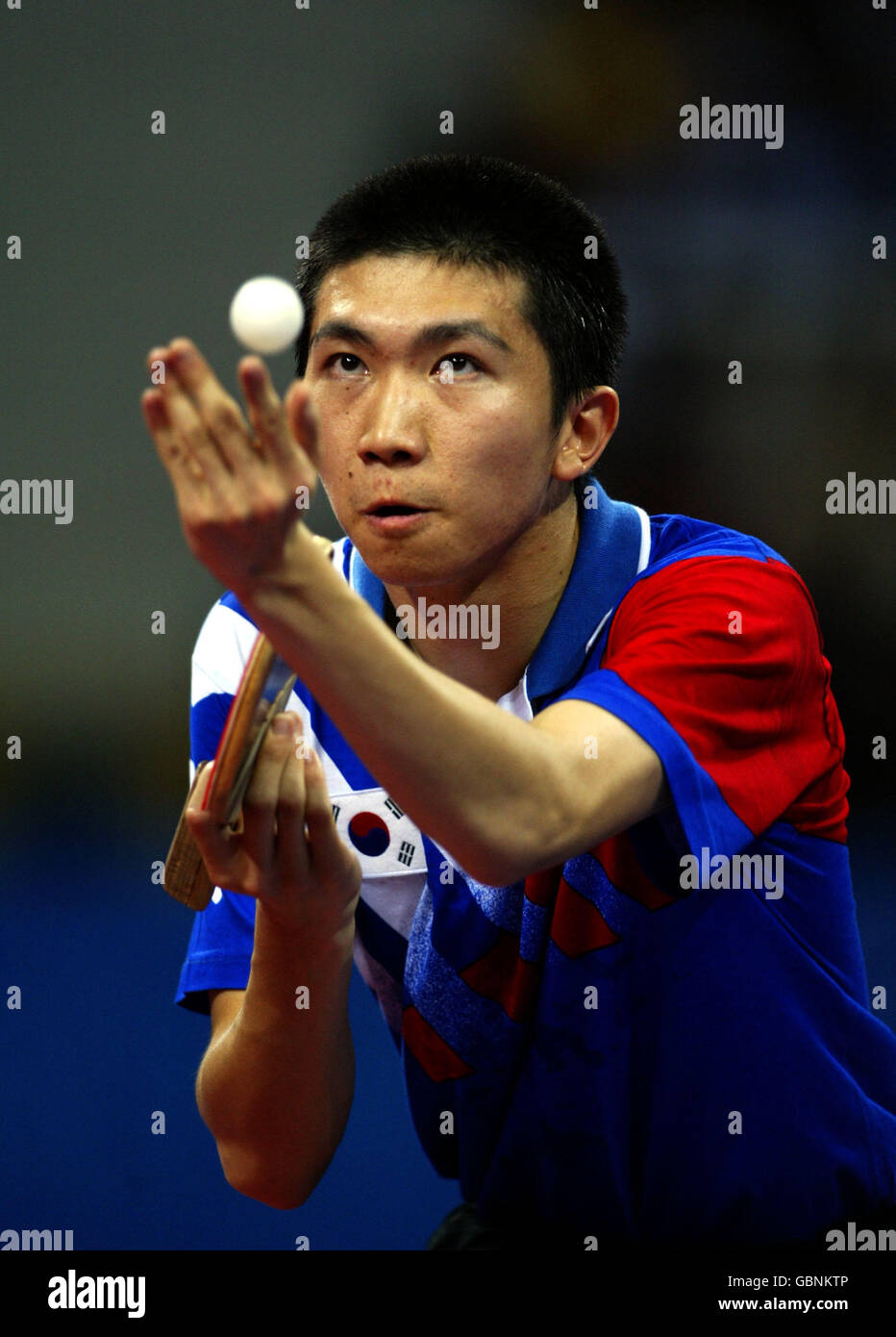 Table Tennis - Athens Olympic Games 2004 - Men's Singles - Final. Korea's Min Seung Ryu serves to China's Hao Chn Wang Stock Photo