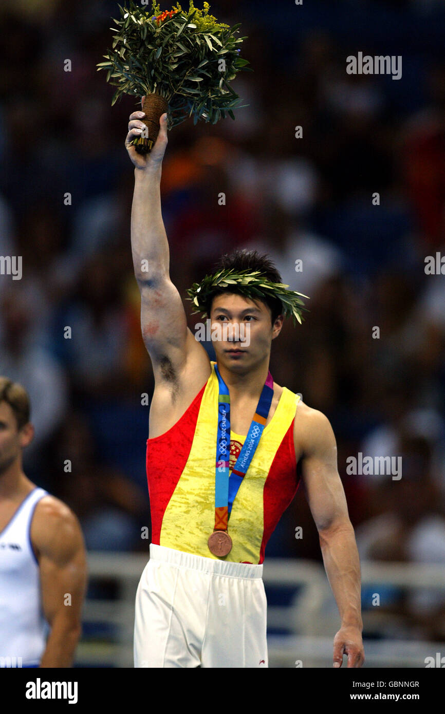 Gymnastics - Athens Olympic Games 2004 - Apparatus Finals. China's Xiaopeng Li celebrates winning the bronze medal Stock Photo