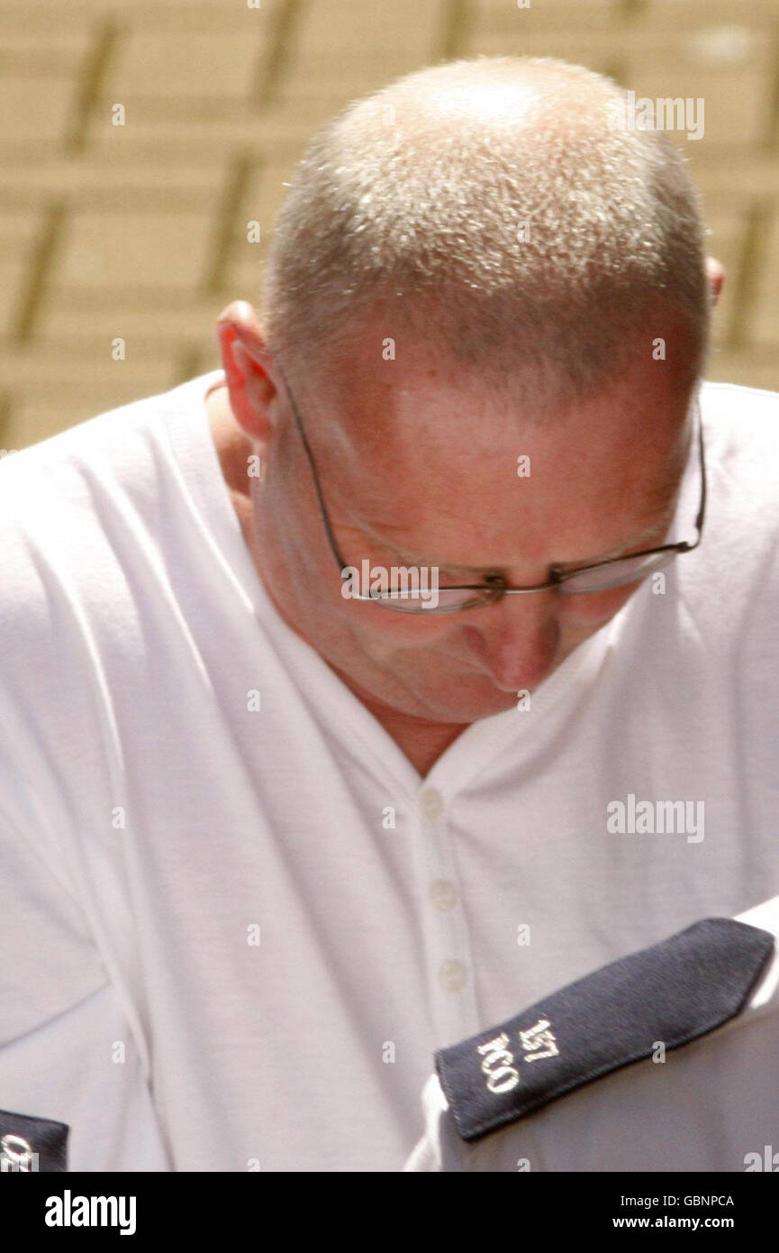 John McGrath is led away from Ballymena Court in Northern Ireland after he appeared in connection with the murder of Kevin McDaid. Stock Photo