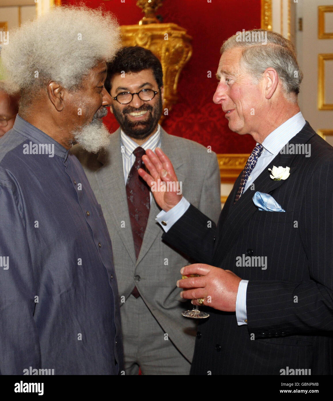 The Prince of Wales, right, Patron of the University of Cambridge Programme for Sustainability Leadership, talks to Professor Wole Soyinka, the 1986 winner of the Nobel Prize in Literature, left, and and Dr Tariq Banuri, centre, who heads the United Nations division for Sustainable Development, during a reception for Nobel Laureates and climate change experts at St James's Palace in London. Stock Photo