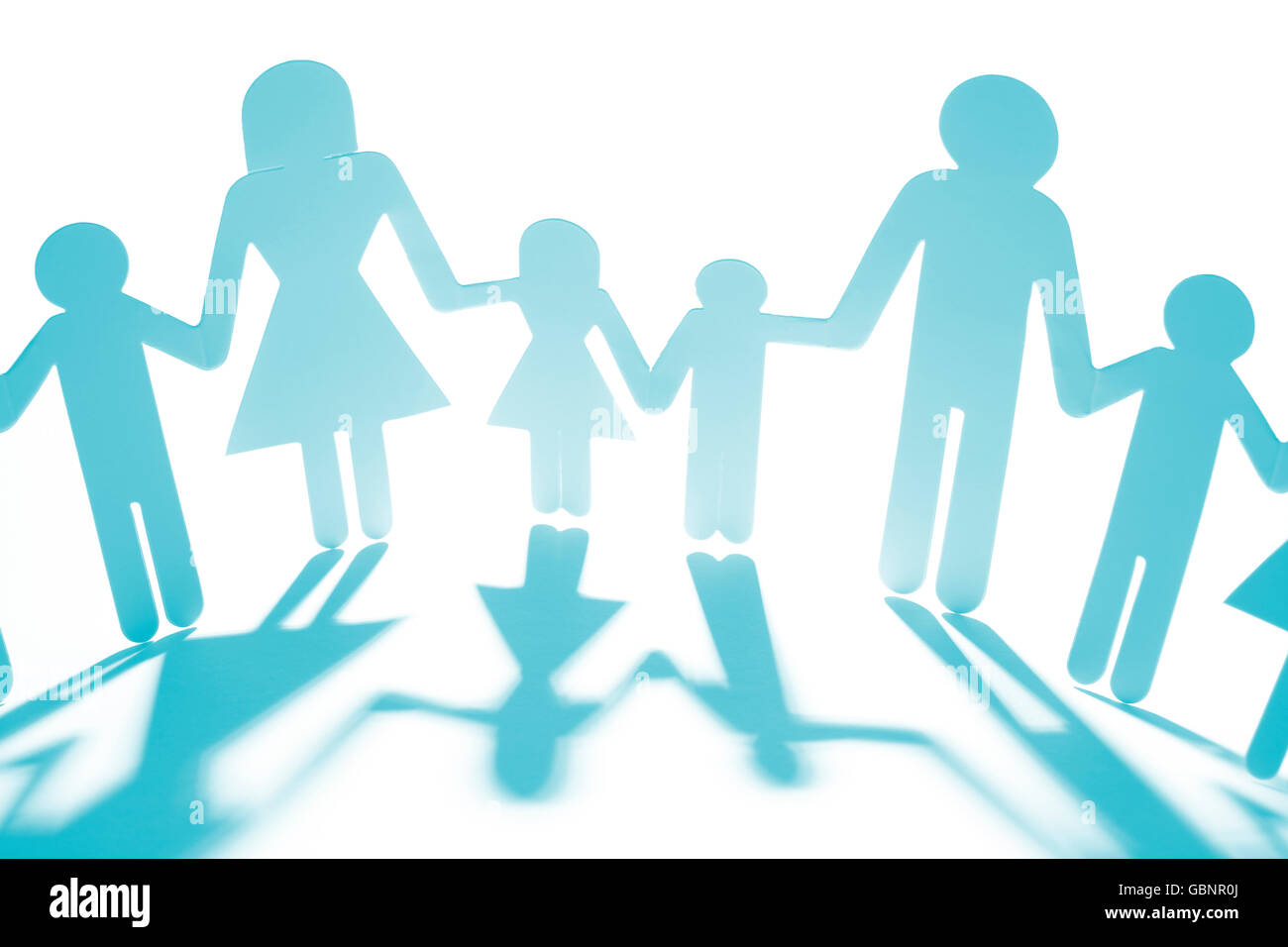 Family paper chain cutout holding hands Stock Photo - Alamy