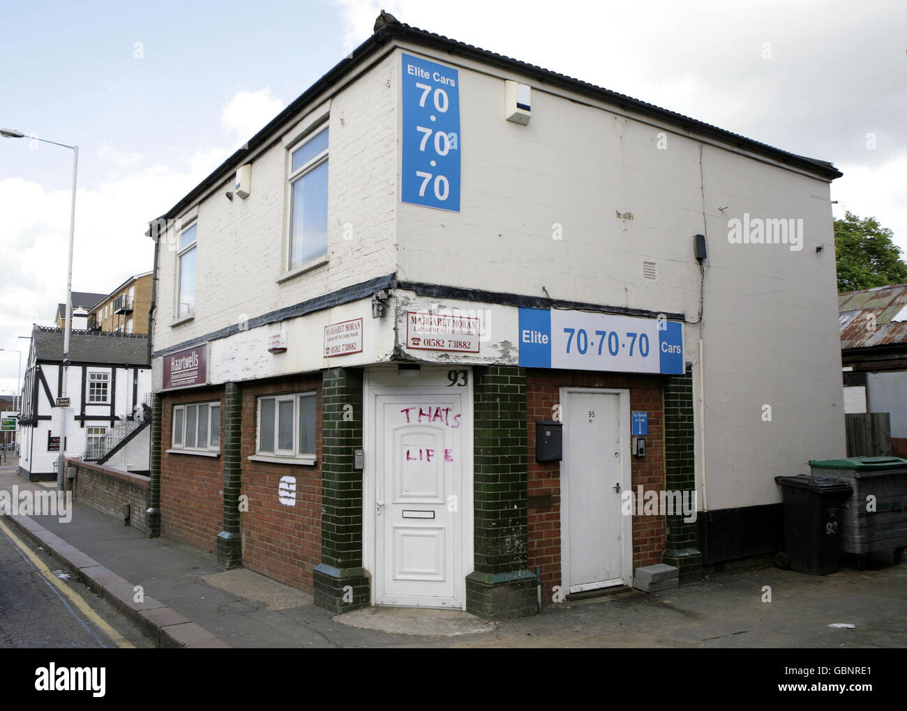 General view of graffiti on the front door of the constituency office of Luton South Labour MP Margaret Moran, who has said she will be stepping down, complaining that the furore over her 22,500 dry rot claim had damaged her health. Stock Photo