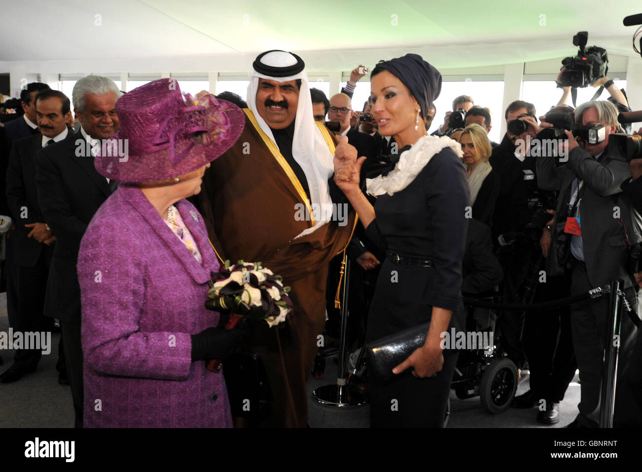 (left to right) Britain's Queen Elizabeth II, The Amir of Qatar and his wife Sheikha Mozah bint Nasser Al-Missned during the official inauguration of the South Hook Liquefied Natural Gas (LNG) Terminal in Milford Haven. Stock Photo