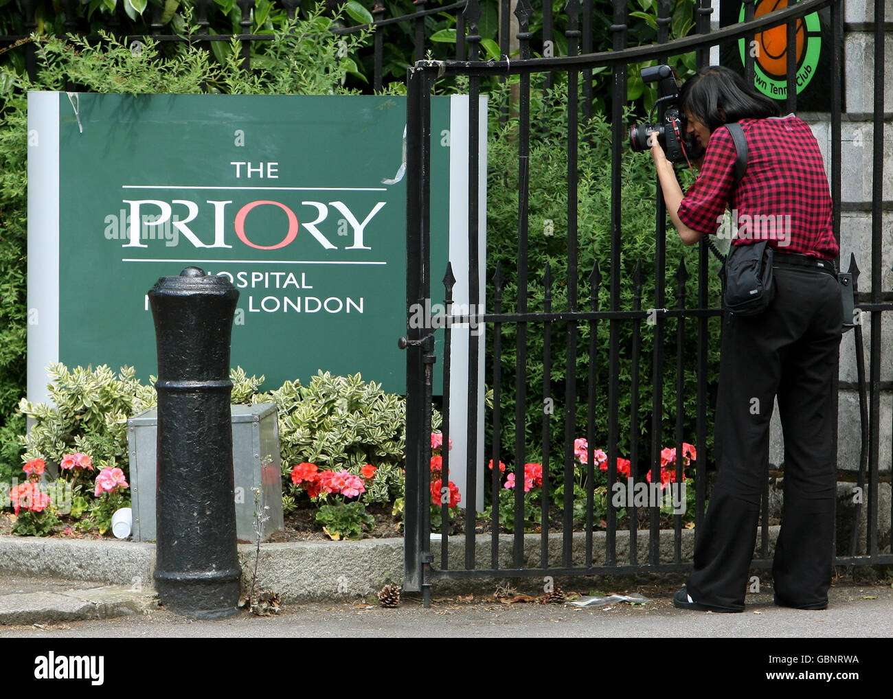A photographer outside the entrance to The Priory Hospital in north London, where Susan Boyle has been admitted following the final of 'Britain's Got Talent.' Stock Photo
