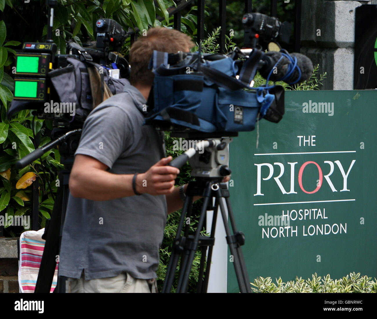 Television crews outside the entrance to The Priory Hospital in north London, where Susan Boyle has been admitted following the final of 'Britain's Got Talent.' Stock Photo