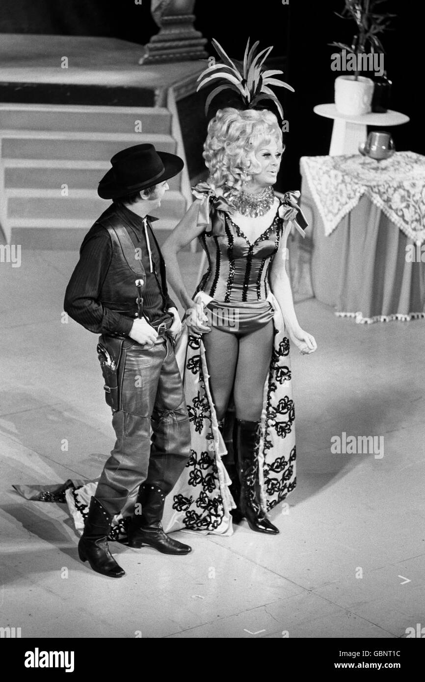 Roy Hudd, left, and Danny La Rue on stage at the Palace Theatre, Cambridge Circus, London, in a scene from their show 'Danny La Rue at the Palace'. In this scene Hudd plays Wild Bill Hickock and La Rue plays Fanny Oakley. Stock Photo