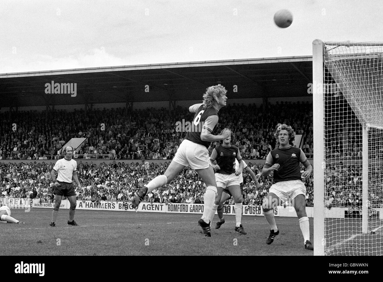 Soccer - League Division One - West Ham United v Burnley - Upton Park. Kevin Lock (No.6) heads over his own crossbar to relieve the pressure of a Burnley attack during their match at Upton Park Stock Photo