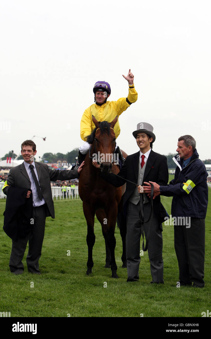 Sea the Stars ridden by Mick Kinane celebrates winning The Investec Derby during The Investec Derby Day at Epsom Racecourse, London. Stock Photo