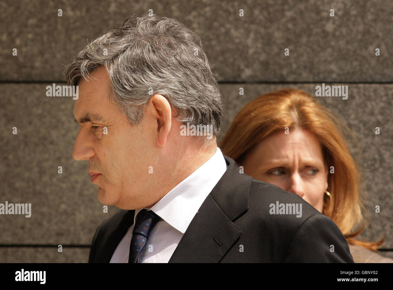 Prime Minister Gordon Brown and his wife Sarah arrive for a memorial service at the Normandy American Cemetery in Colleville-sur-Mer, France, on the 65th anniversary of the D-Day landings. Stock Photo