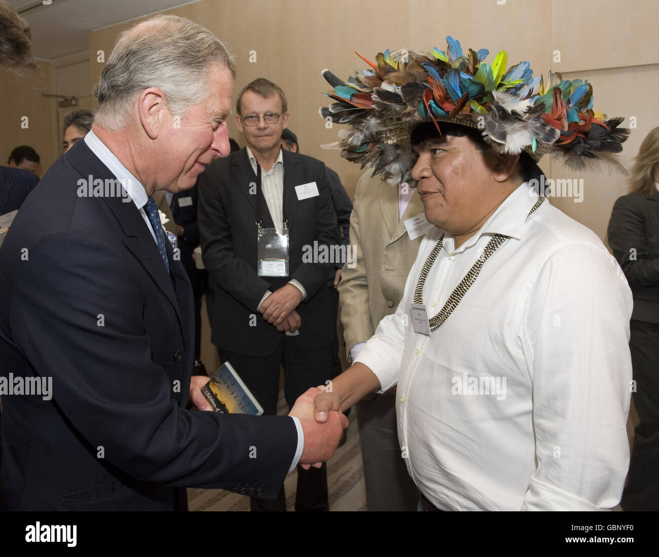The Prince of Wales meets Amazonian tribal leader Chief Almir Narayamoga Surui, from the Surui tribe at Google's annual European Zeitgeist gathering in Hertfordshire. Stock Photo
