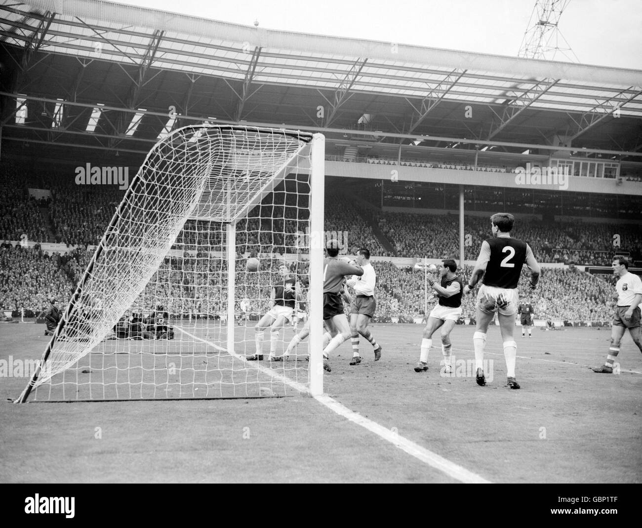 A header from Preston North End's Alex Dawson (out of pic) drops into the net to give his side a 2-1 lead, watched by teammate Alec Ashworth (third r) and West Ham United's John Bond (r), Eddie Bovington (second r), Jim Standen (second l) and Jack Burkett (l) Stock Photo