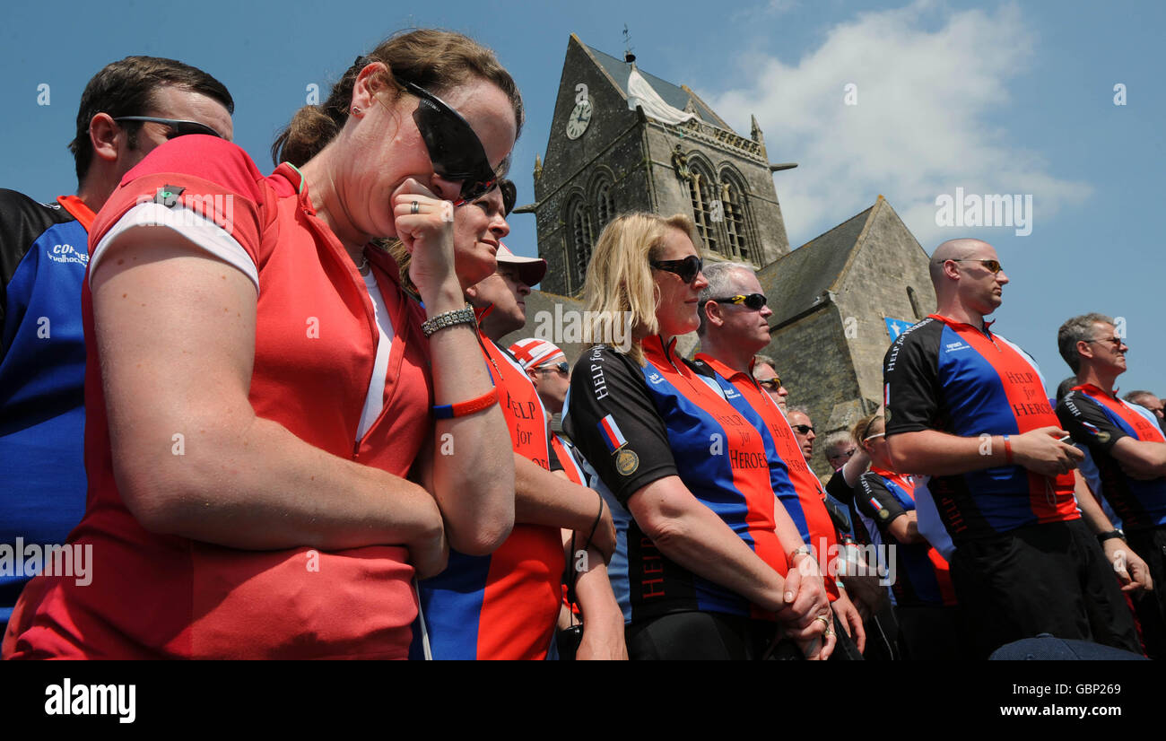 Cyclists from the Band of Brothers Battlefield Bike Ride at the memorial to the 82nd Airborne Division, Ste Mere Eglise, northern France. Stock Photo