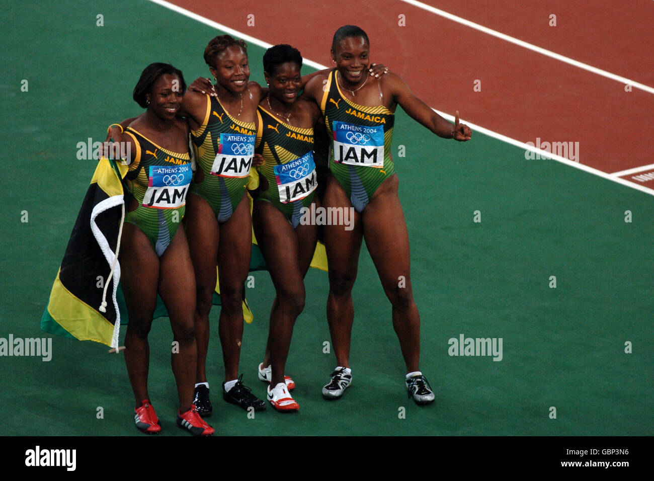 (L-R) The Jamacia team of Veronica Campbell, Sherone Simpson, Tayna Lawrence and Aleen Bailey celebrate winning the gold medal Stock Photo