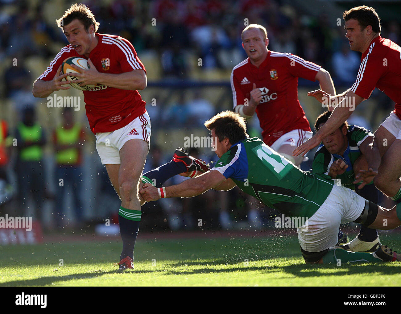 British and Irish Lions' Tommy Bowe (left) breaks through the Royal Highfeld XV defence to score his sides first try during the Tour match at Royal Bafokeng Sports Palace, Phokeng, South Africa. Stock Photo