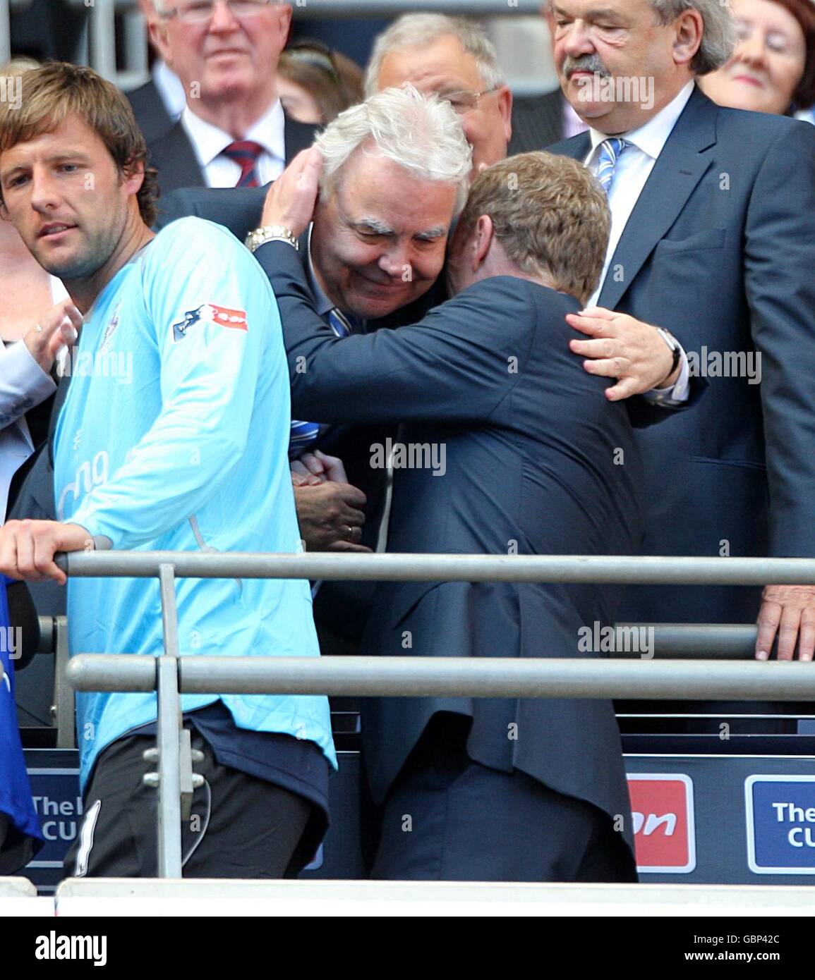Everton chairman Bill Kenwright gives manager David Moyes a hug as he collects his losers medal Stock Photo