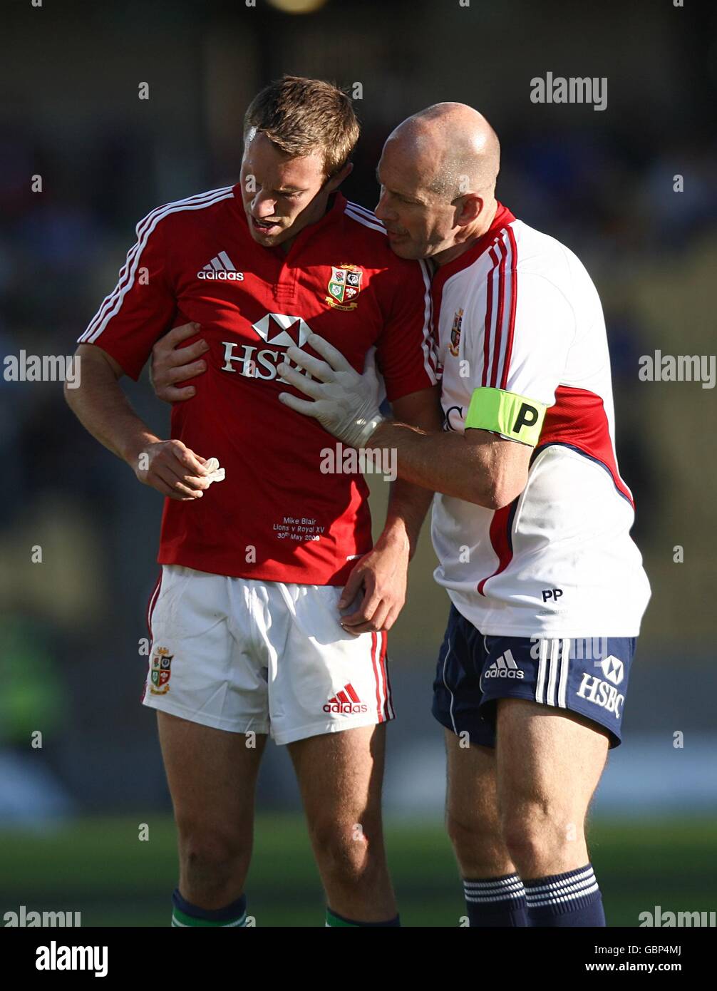 British and Irish Lions' Physiotherapist Phil Pask (right)checks on the condition of Mike Blair Stock Photo