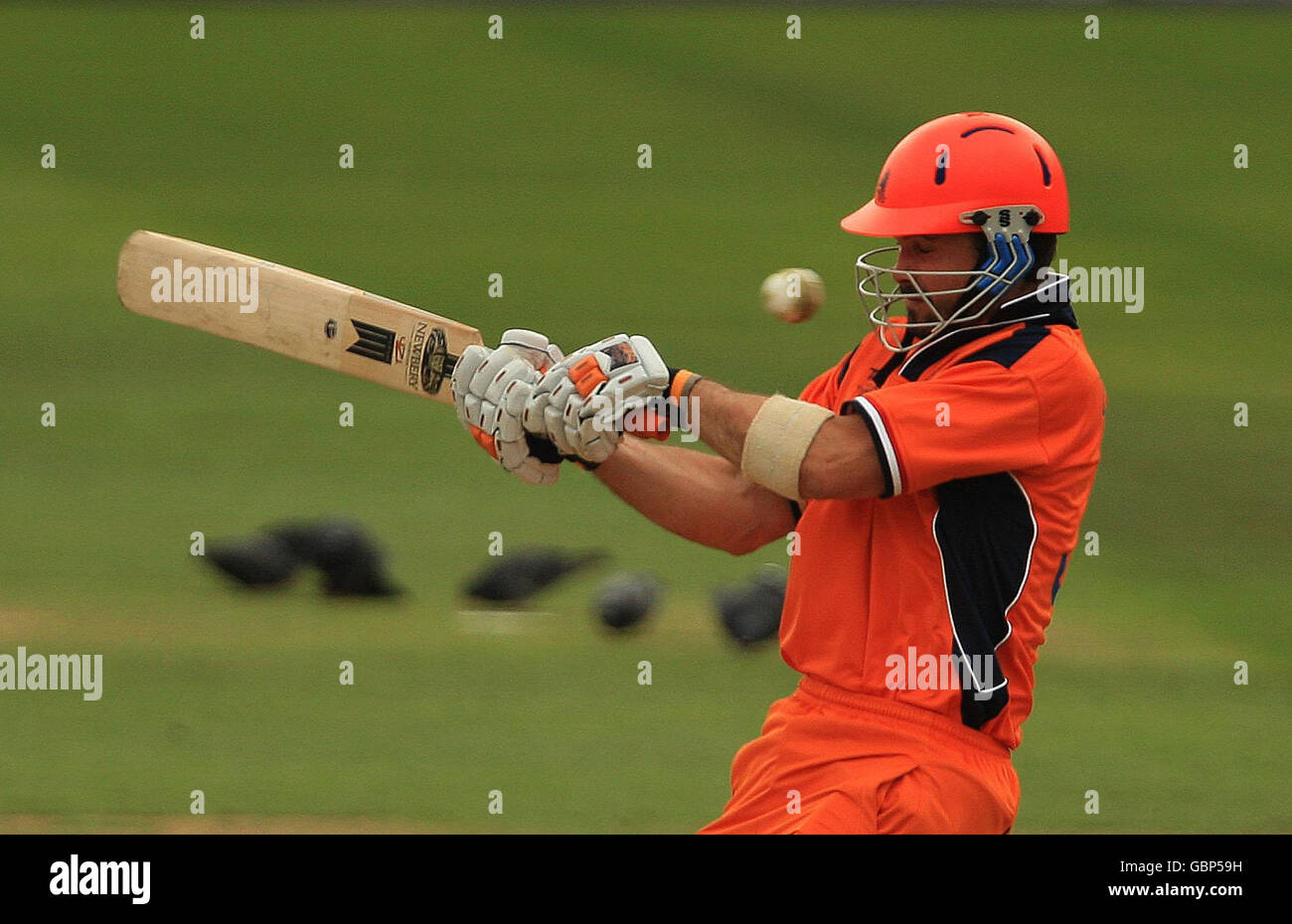 Netherland's Bas Zuiderent trys to hook the ball away from his helmet grill during the Twenty20 World Cup warm up match at The Brit Oval, London, Stock Photo