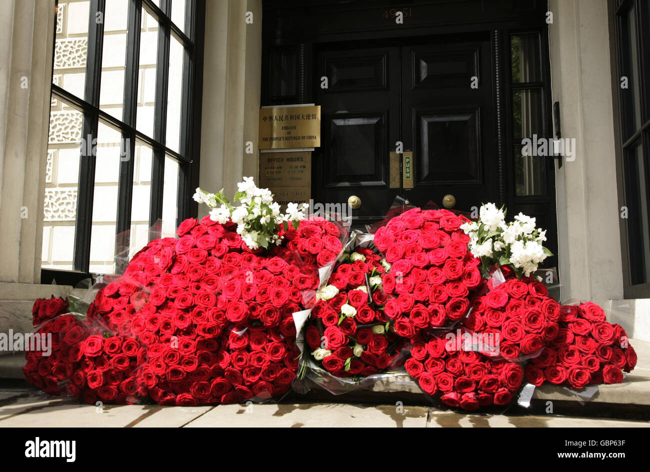Flowers on the steps of the Chinese Embassy in central London, left by survivors and supporters, to mark the 20th anniversary of the bloody crackdown on pro-democracy activists by the Chinese government. Stock Photo