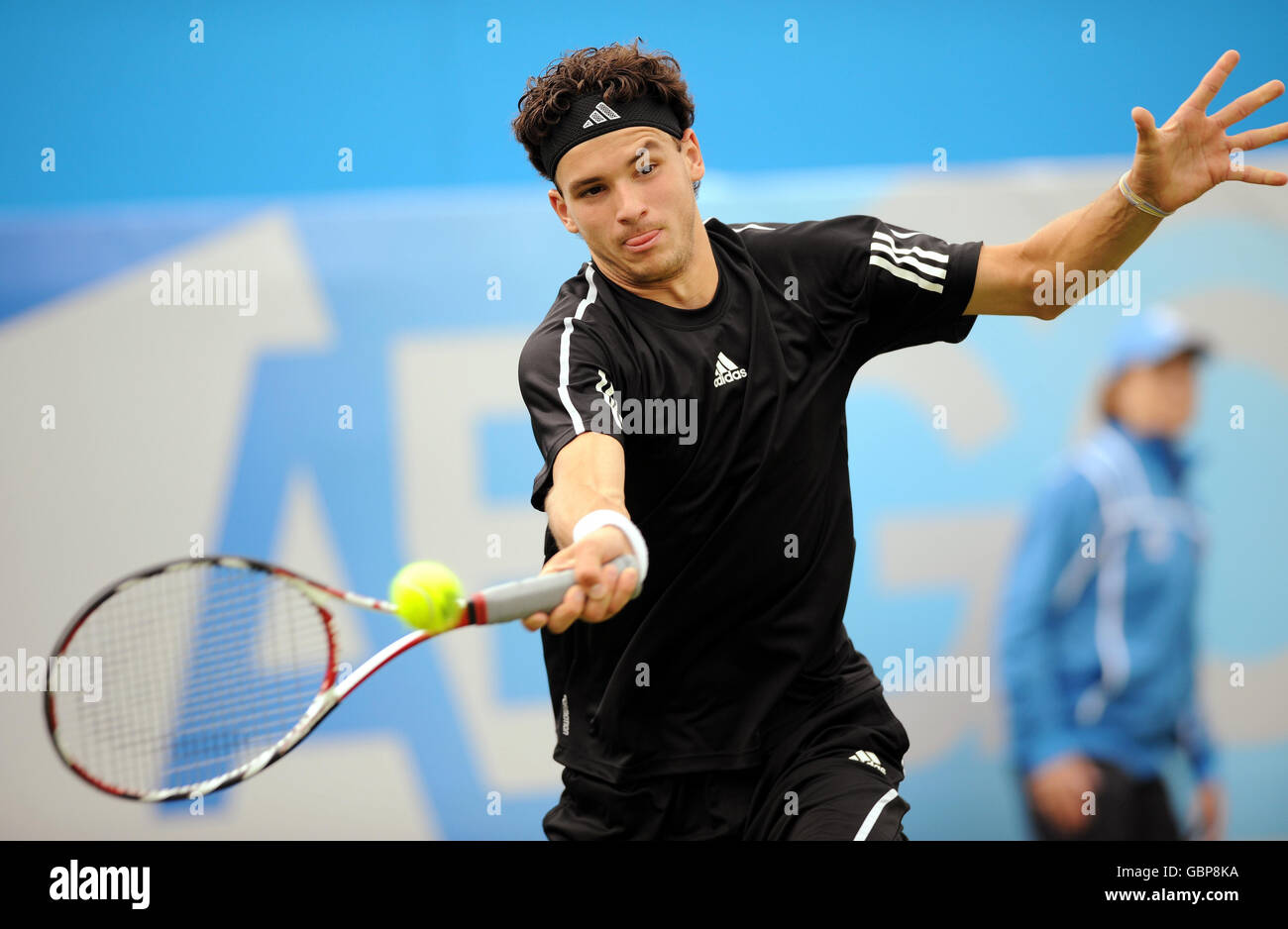 2008 Junior Wimbledon Boy's winner Grigor Dimitrov from Bulgaria, in action as a wild card in the men's singles during day three of the AEGON Championships at The Queen's Club, London. Stock Photo