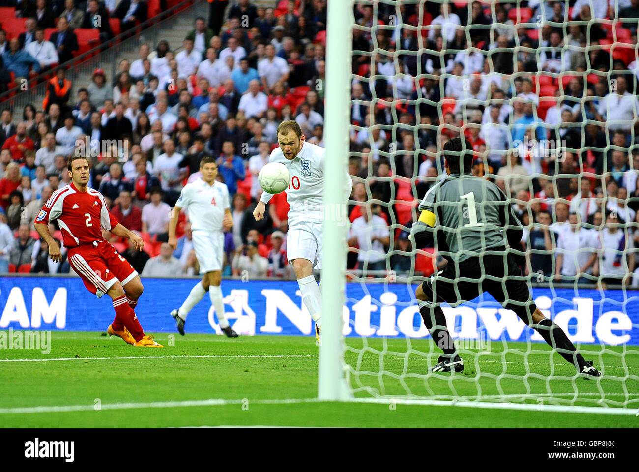 Soccer - Fifa World Cup 2010 - Qualifying Round - Group Six - England v Andorra - Wembley Stadium. England's Wayne Rooney (centre) scores his sides first goal of the game Stock Photo