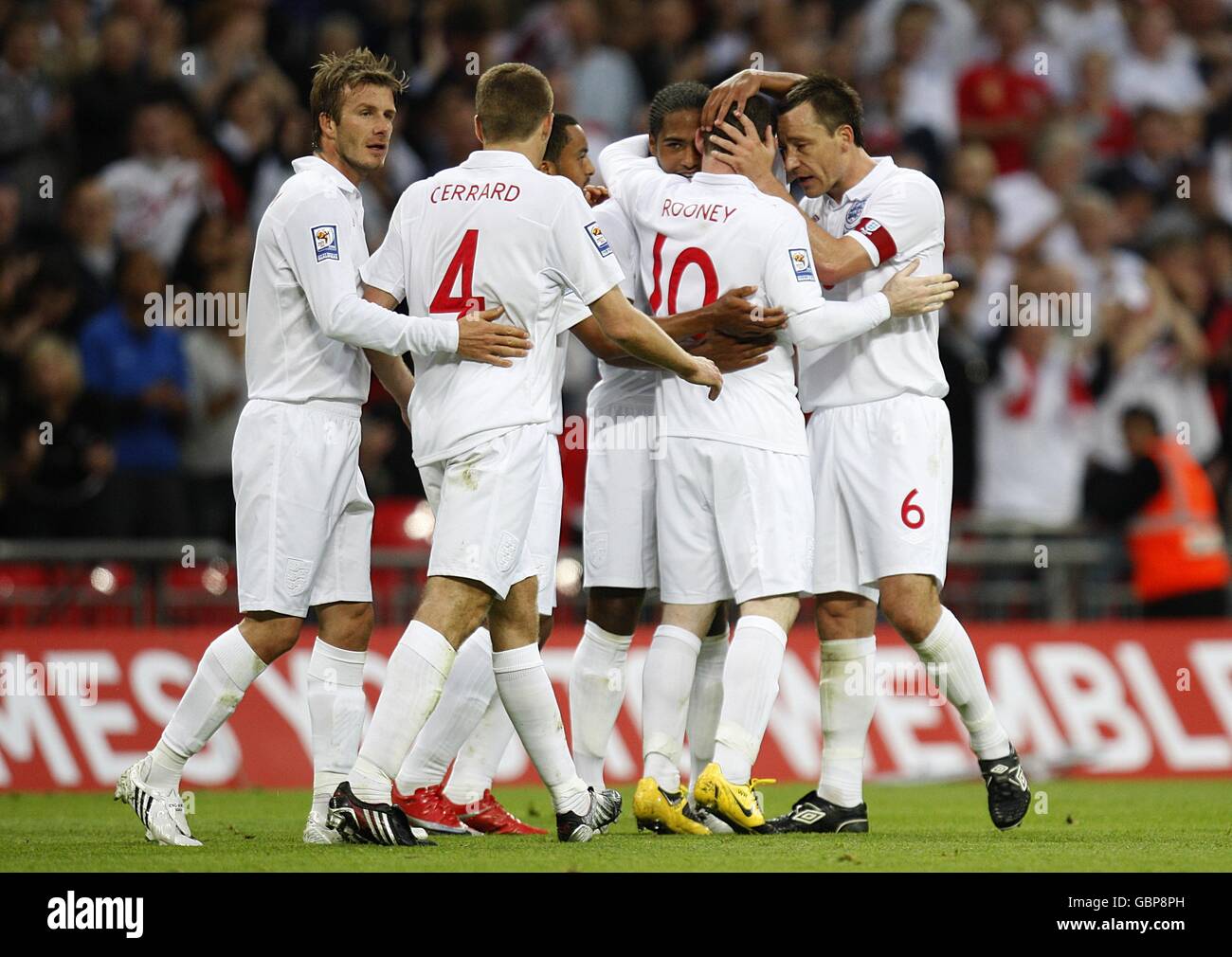 Soccer - Fifa World Cup 2010 - Qualifying Round - Group Six - England v Andorra - Wembley Stadium. England's Wayne Rooney (right from centre) celebrates with team mate John Terry (far right) after scoring his sides third goal of the game. Stock Photo